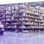 Two employees checking inventory in temporary storage in a distribution warehouse.